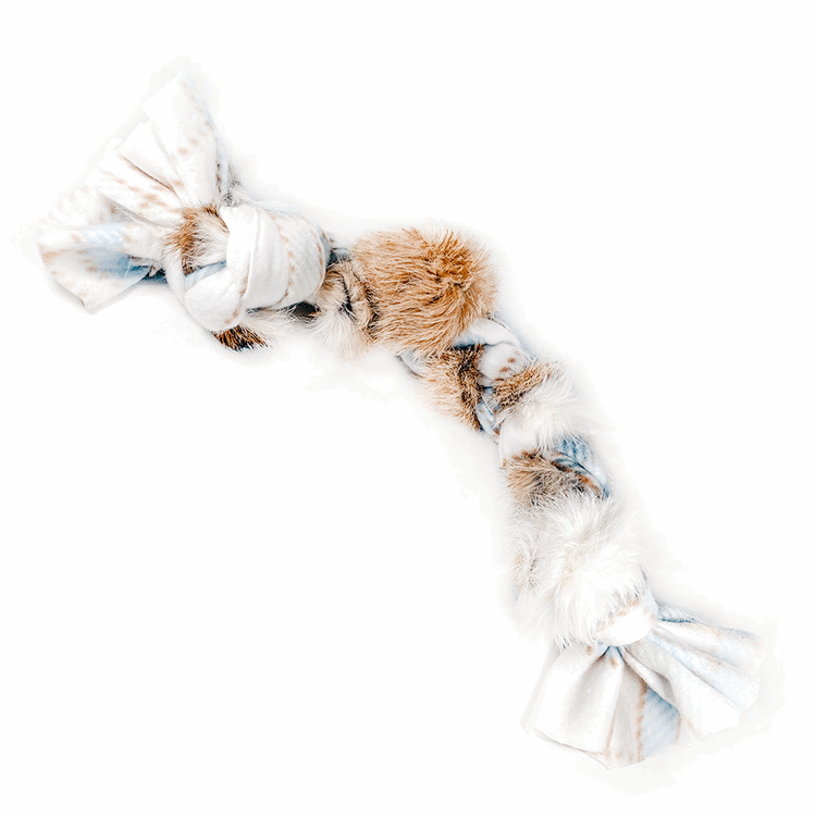 Dog toy with fur and rope on a white background