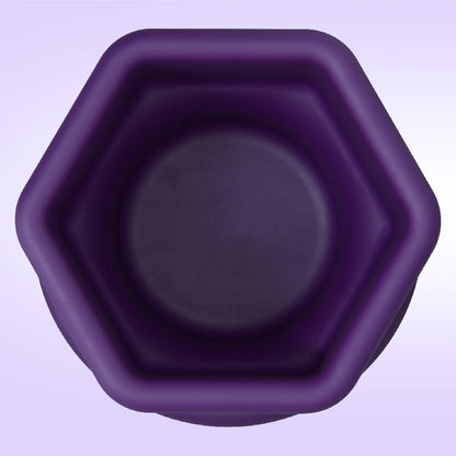 Hexagonal purple container on a light purple background