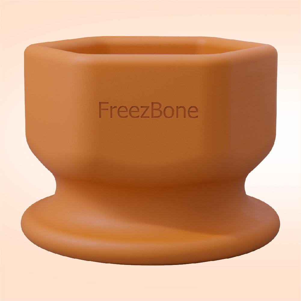Brown silicone cup with 'FreezBone' branding on a beige background