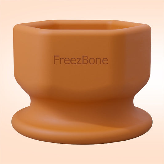Brown silicone cup with 'FreezBone' branding on a beige background