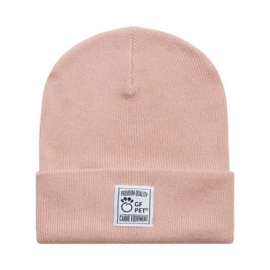 Pink beanie with a label on a white background