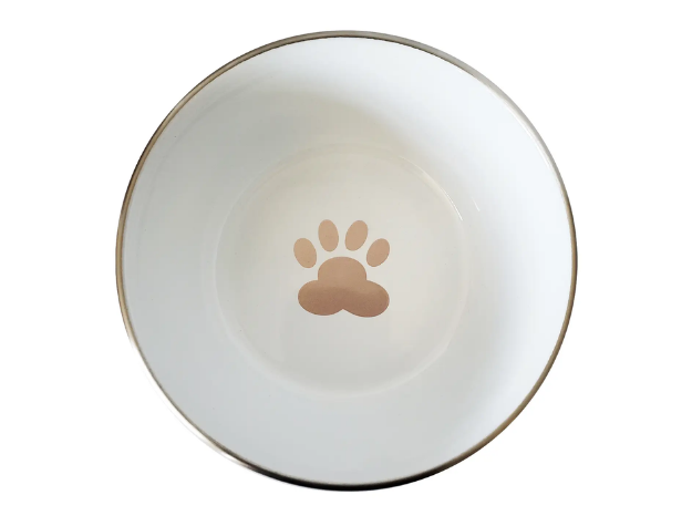 White dog bowl with a rose gold paw print on a white background