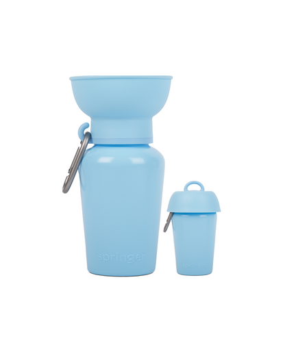 Blue silicone water bottle with detachable cup on a white background