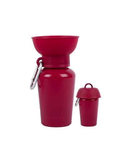 Red water bottle with detachable funnel and carrying clip on a white background