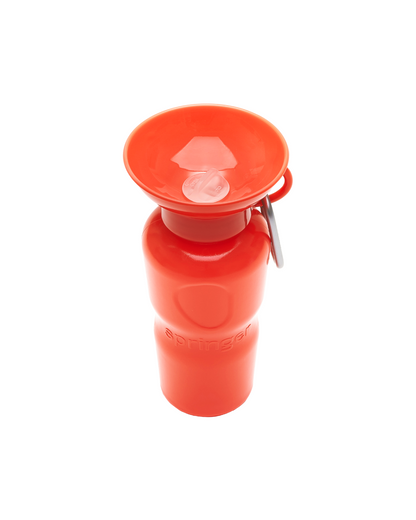Red water bottle with a flip lid on a white background