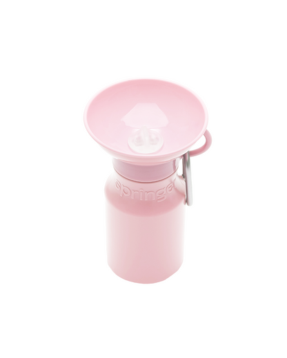 Pink water bottle with a matching cap on a white background