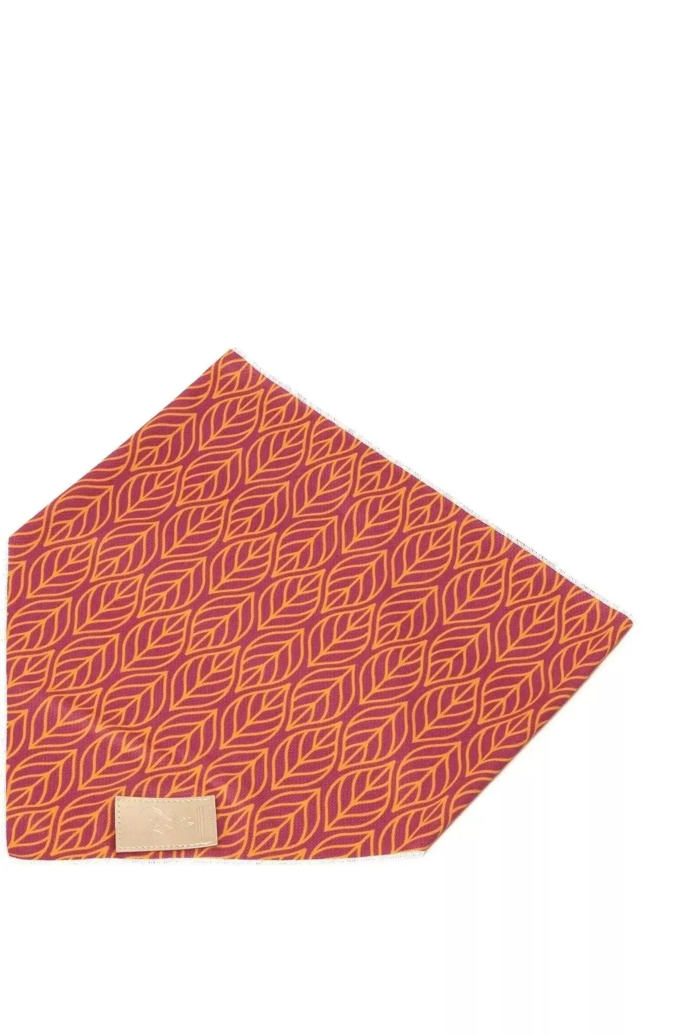 Red patterned fabric with a beige label on a white background