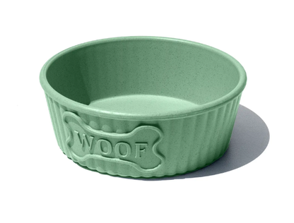 Green pet bowl with 'WOOF' and bone design on a white background