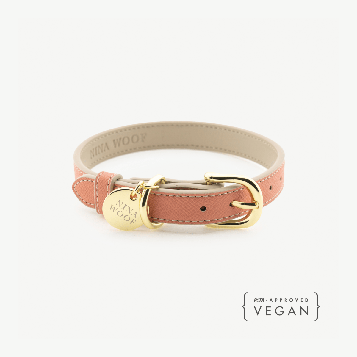 Peach Dog collar with gold buckle and 'Nina Woof' branding on a white background