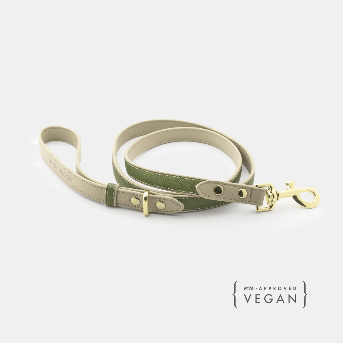 Dog leash with green and beige design on a white background