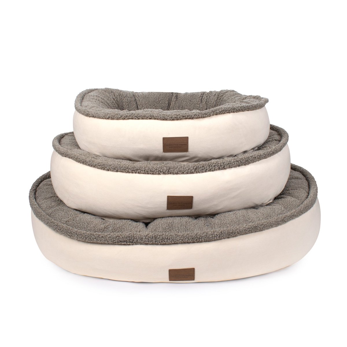 Three pet beds in beige, brown, and gray on a white background