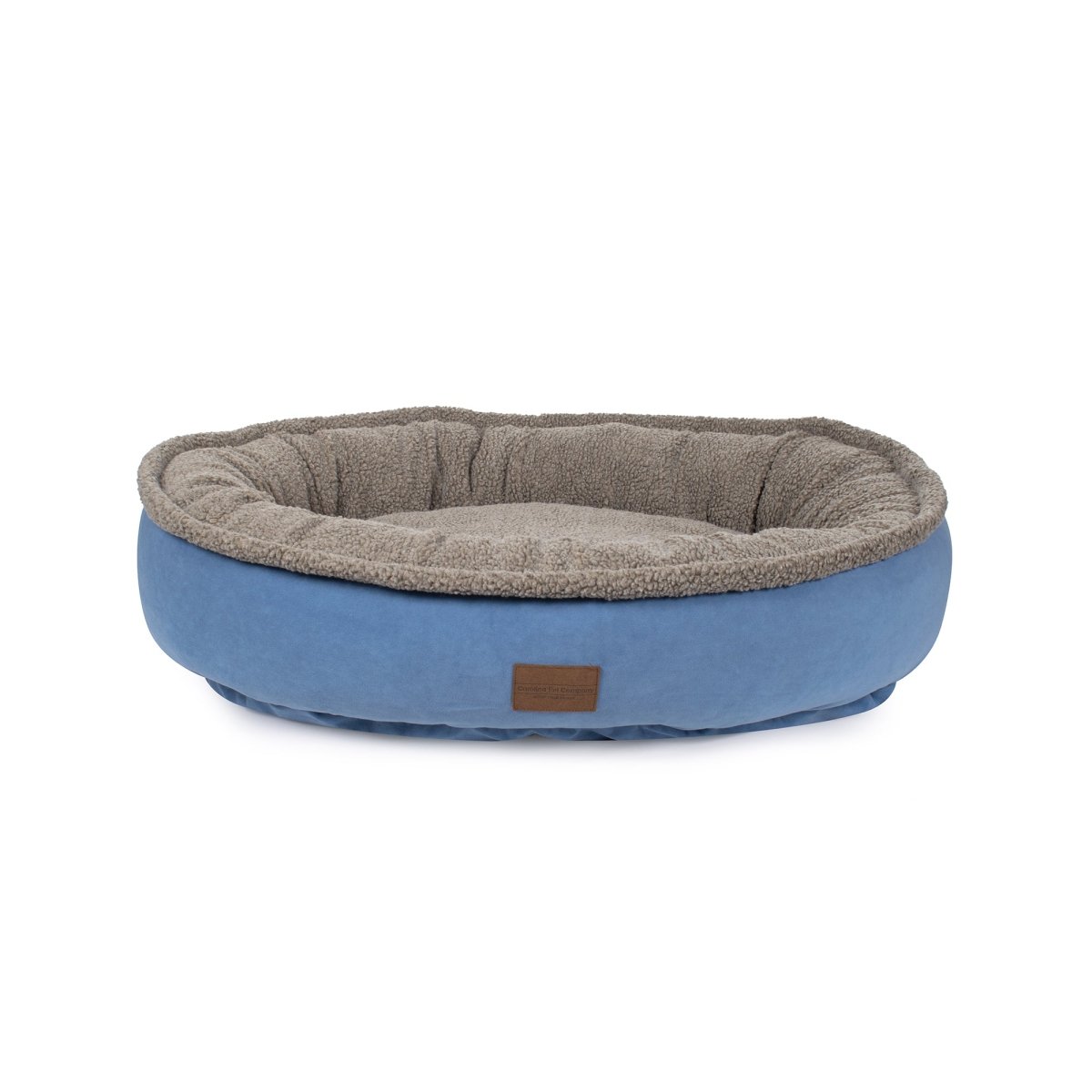 Pet bed with brown interior and blue exterior on a white background