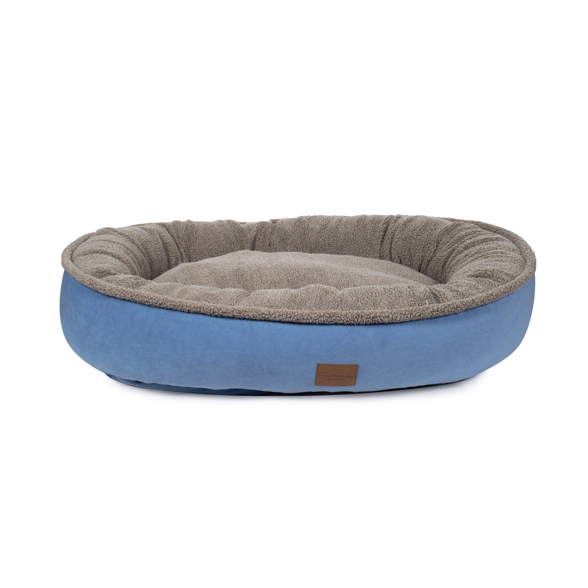 Dog bed with brown top and blue bottom on a white background