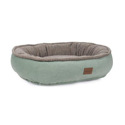 Pet bed with brown interior and green exterior on a white background
