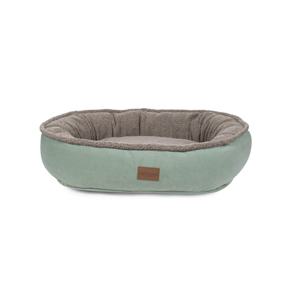 Pet bed with a brown interior and light green exterior on a white background