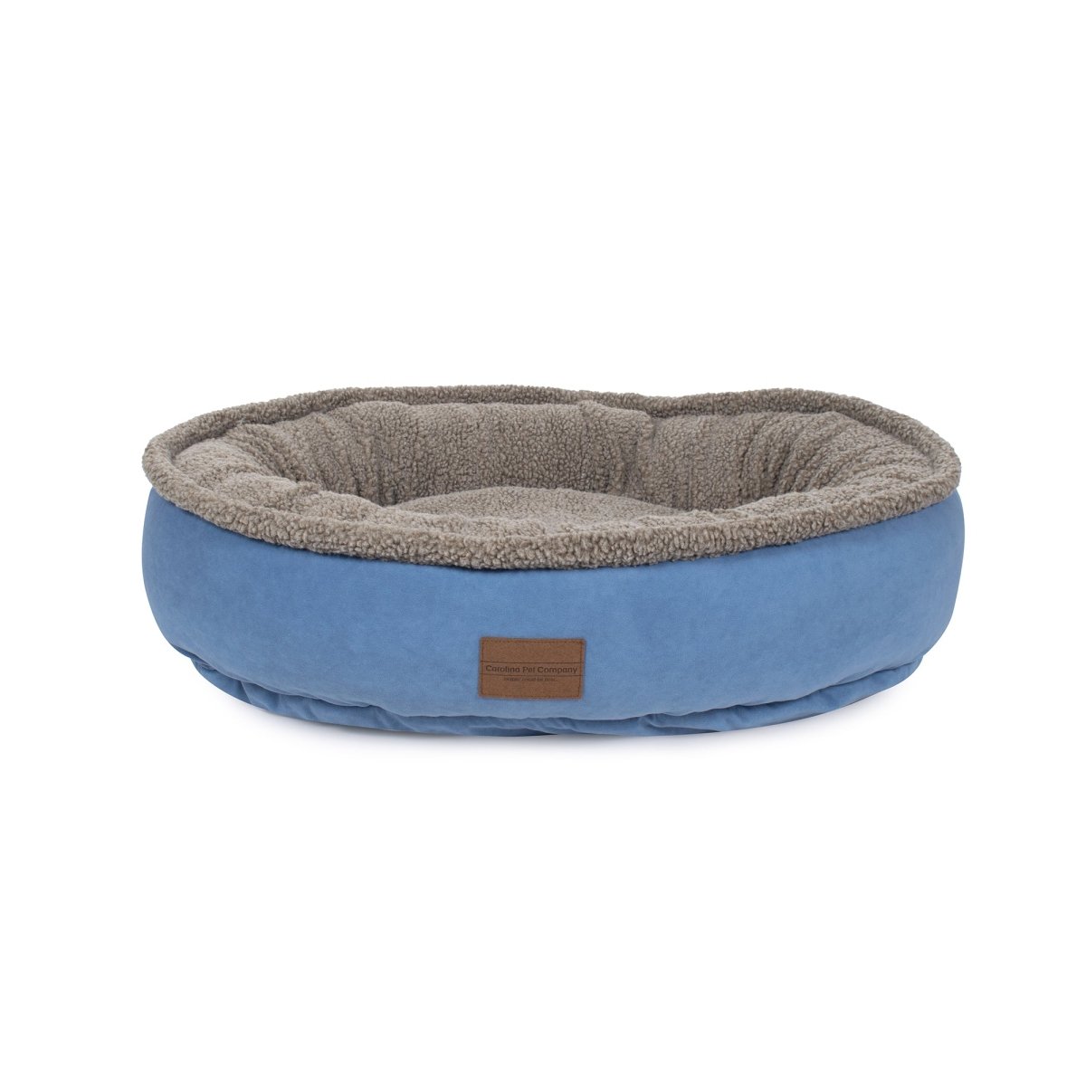Blue pet bed with brown interior on a white background
