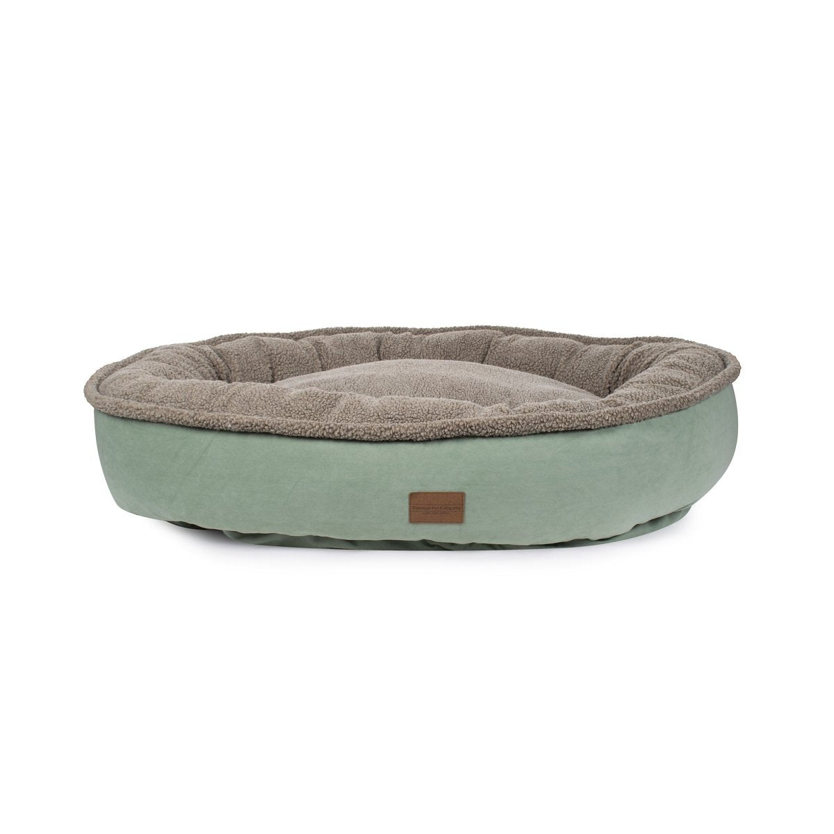 Green pet bed with brown cushion on a white background
