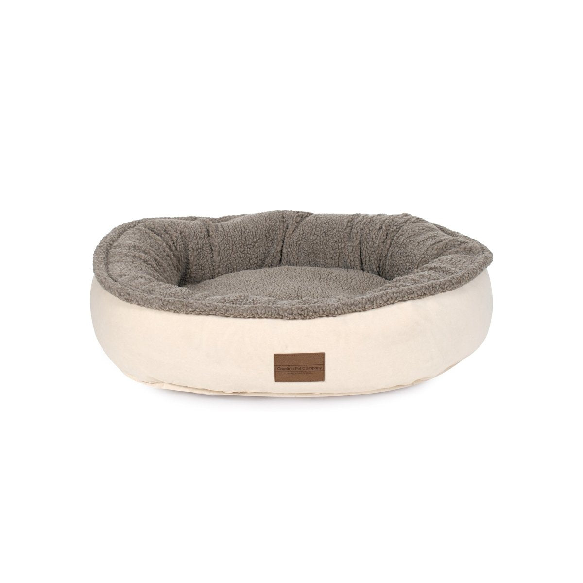 Pet bed with gray interior and beige exterior on a white background