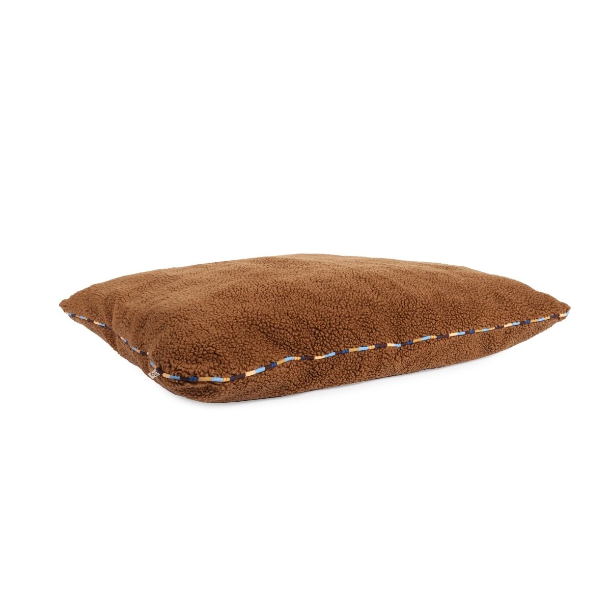 Brown dog pillow on a white background