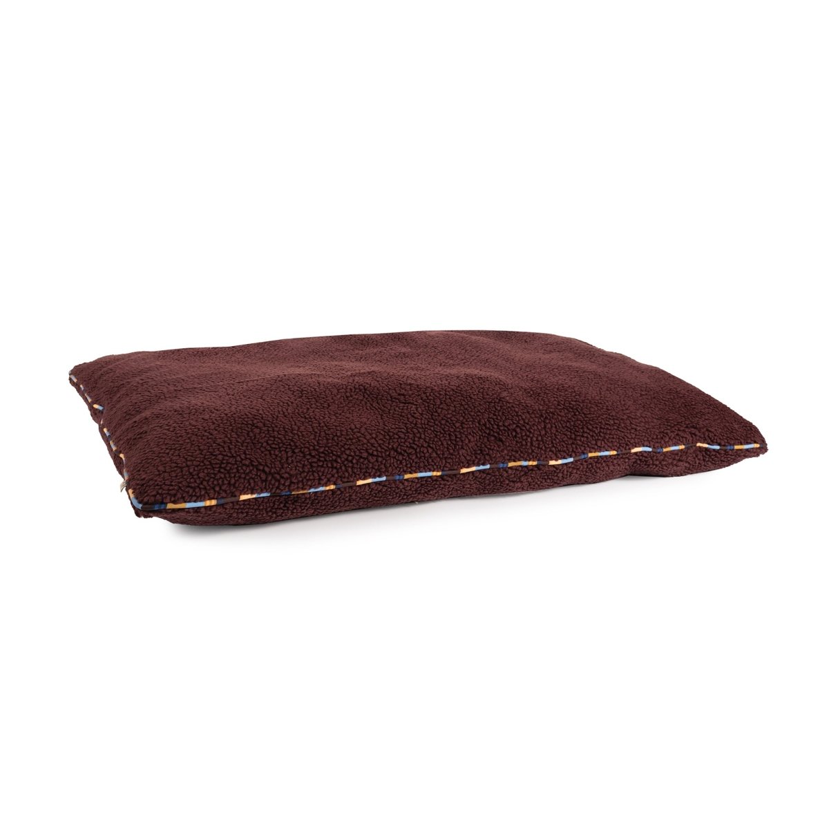 Brown rectangular pillow with visible stitching on a white background