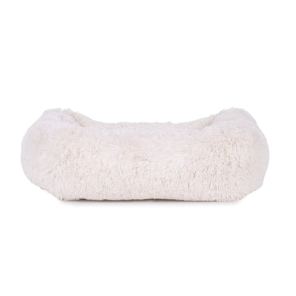White fluffy dog bed on a white background