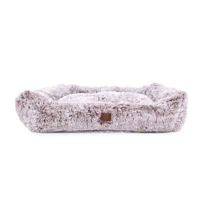 Fluffy pet bed with a brand logo on a white background