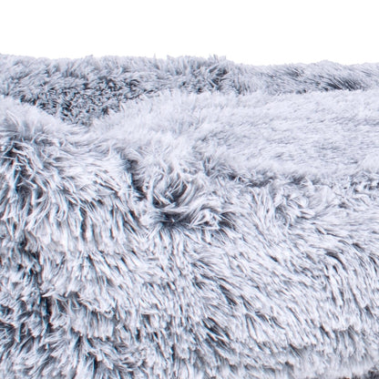Close-up of a textured gray white pet bed with a fluffy texture