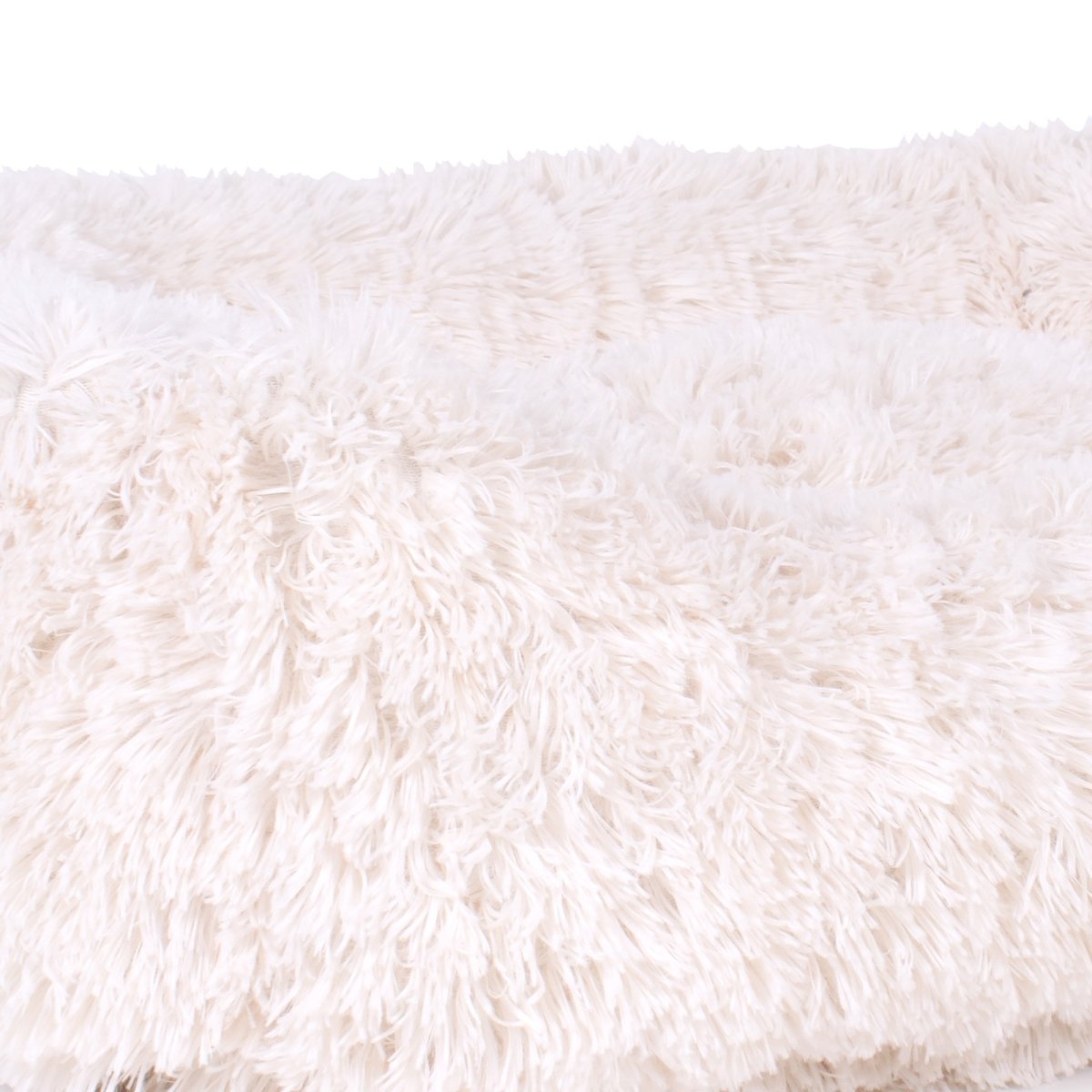 Close-up of a fluffy white pet bed with soft texture