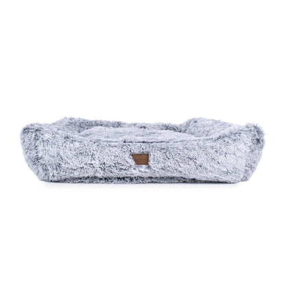 Fluffy gray pet bed on a white background